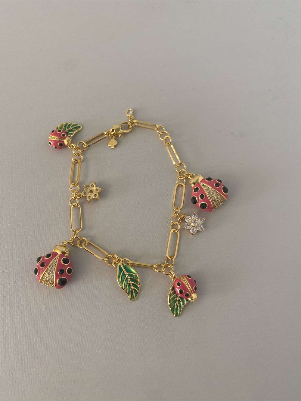 Gold-Tone Pink Ladybug & Green Leaf paper lip Charm Bracelet